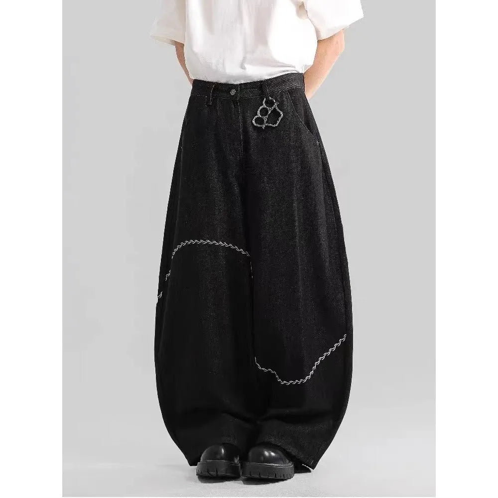 Black straight-leg men's trousers with a mid waist and zip fly, made from micro-elastic denim.