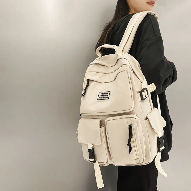 Black and white nylon student backpack with laptop compartment and three-dimensional pockets
