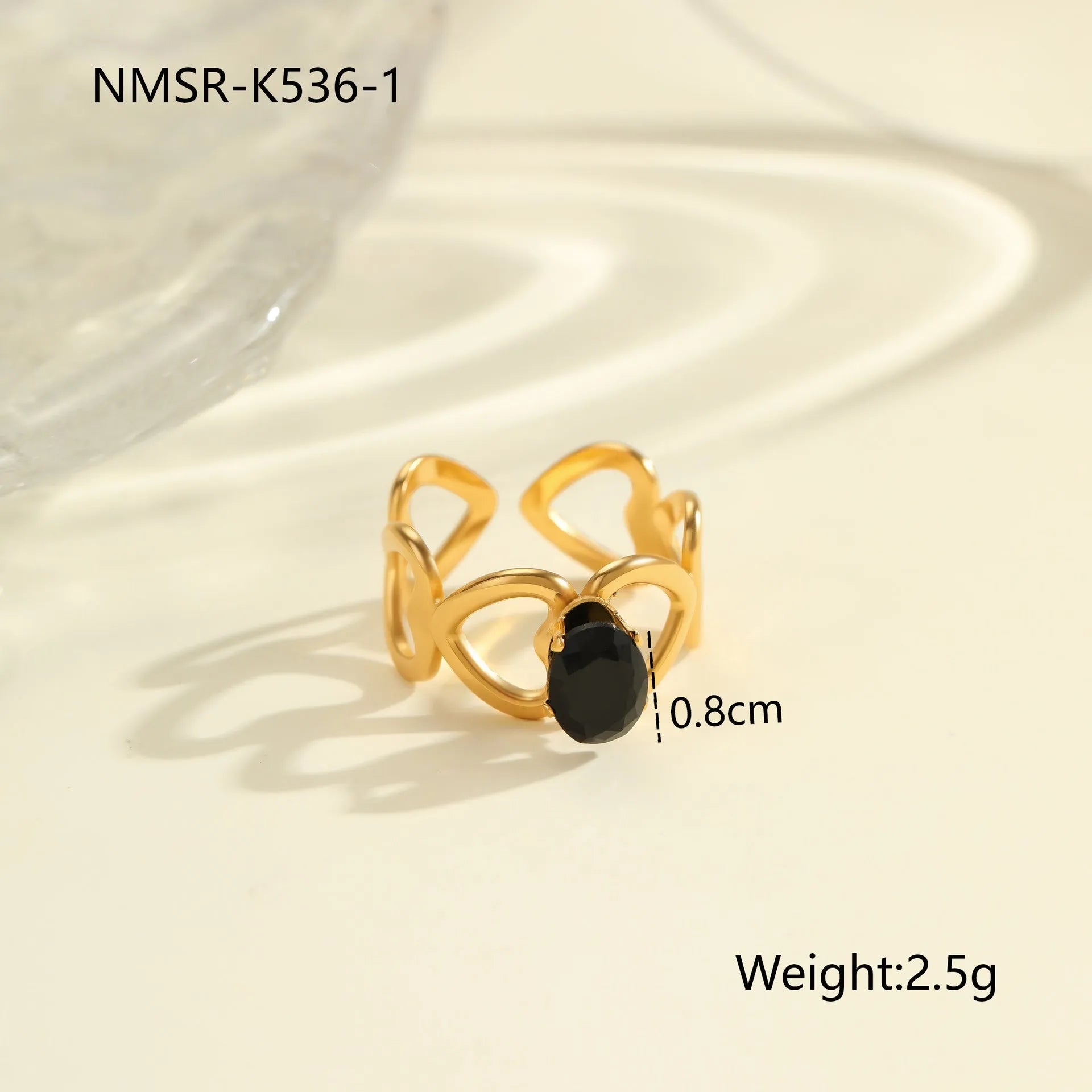 Geometric open mouth titanium steel ring for women on a plain background.