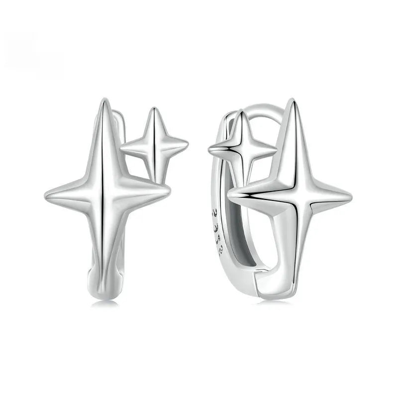 Sterling silver star clip earrings with oxidised finish and XINGX design details