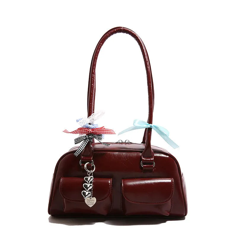 Retro brown PU leather women's shoulder bag with pillow-shaped design and double strap.