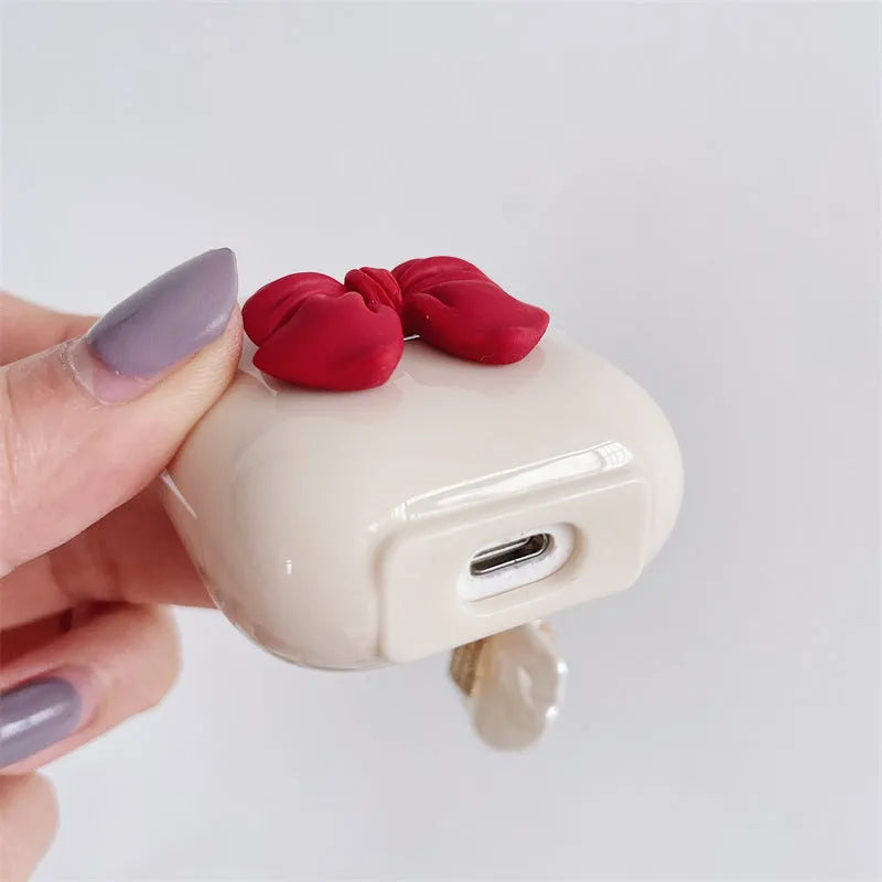 Beige red bow shell patterned TPU protective case for AirPods Pro and other models.