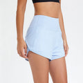 Women's black high-waist quick-dry nylon sports shorts for running and fitness.