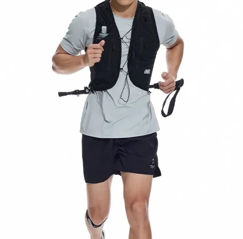 Men's black running shorts with laser stitching detail on a grey background