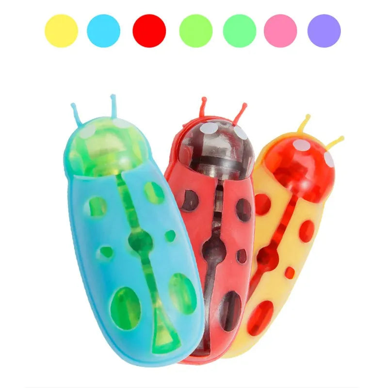 Red mini electric ladybug cat toy with 12 legs, shown on a flat surface.