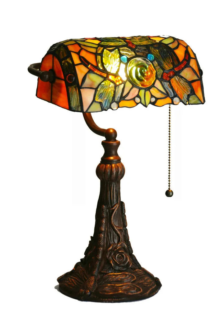 10-inch Tiffany desk lamp with coloured stained glass shade and resin base on a table.