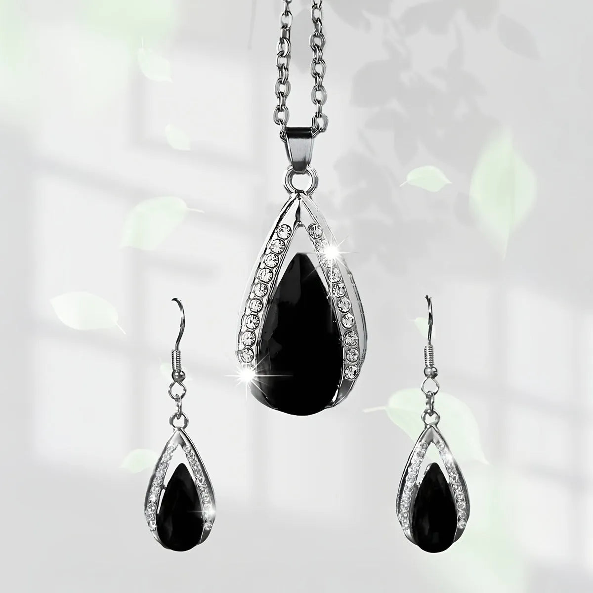 Black and red alloy necklace and earrings set with teardrop glass pendants