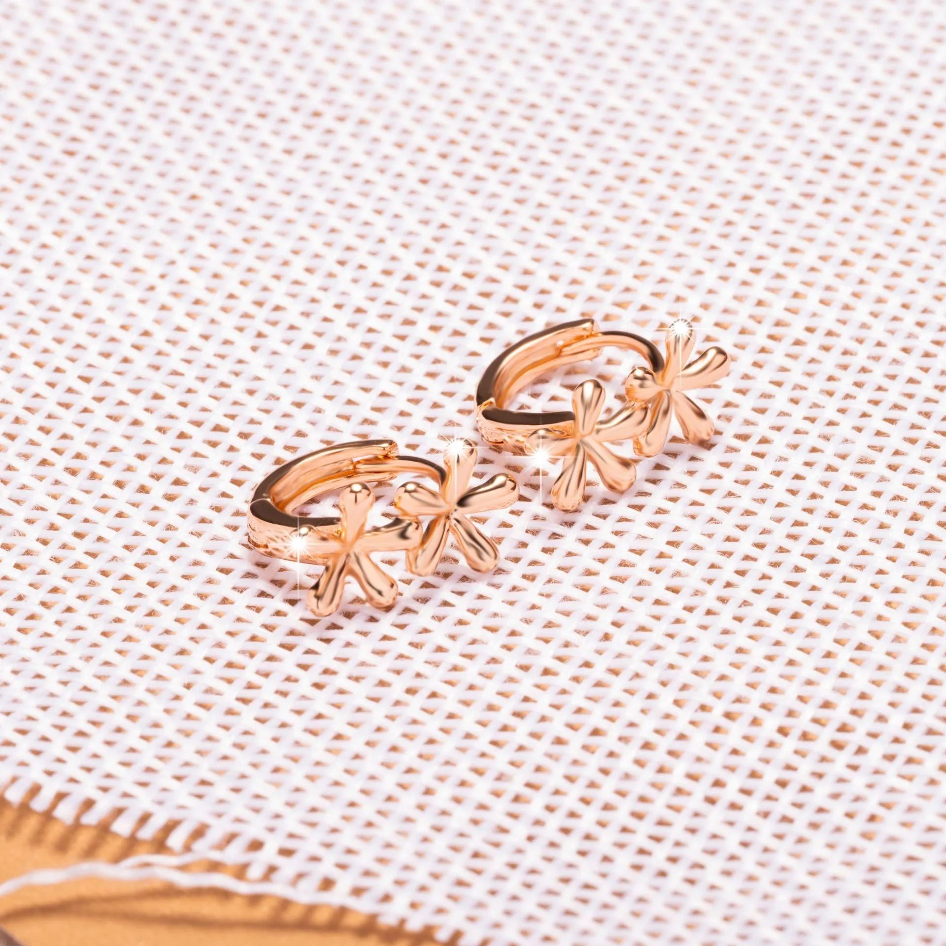 Circular rose gold earrings with waterdrop flower design for women
