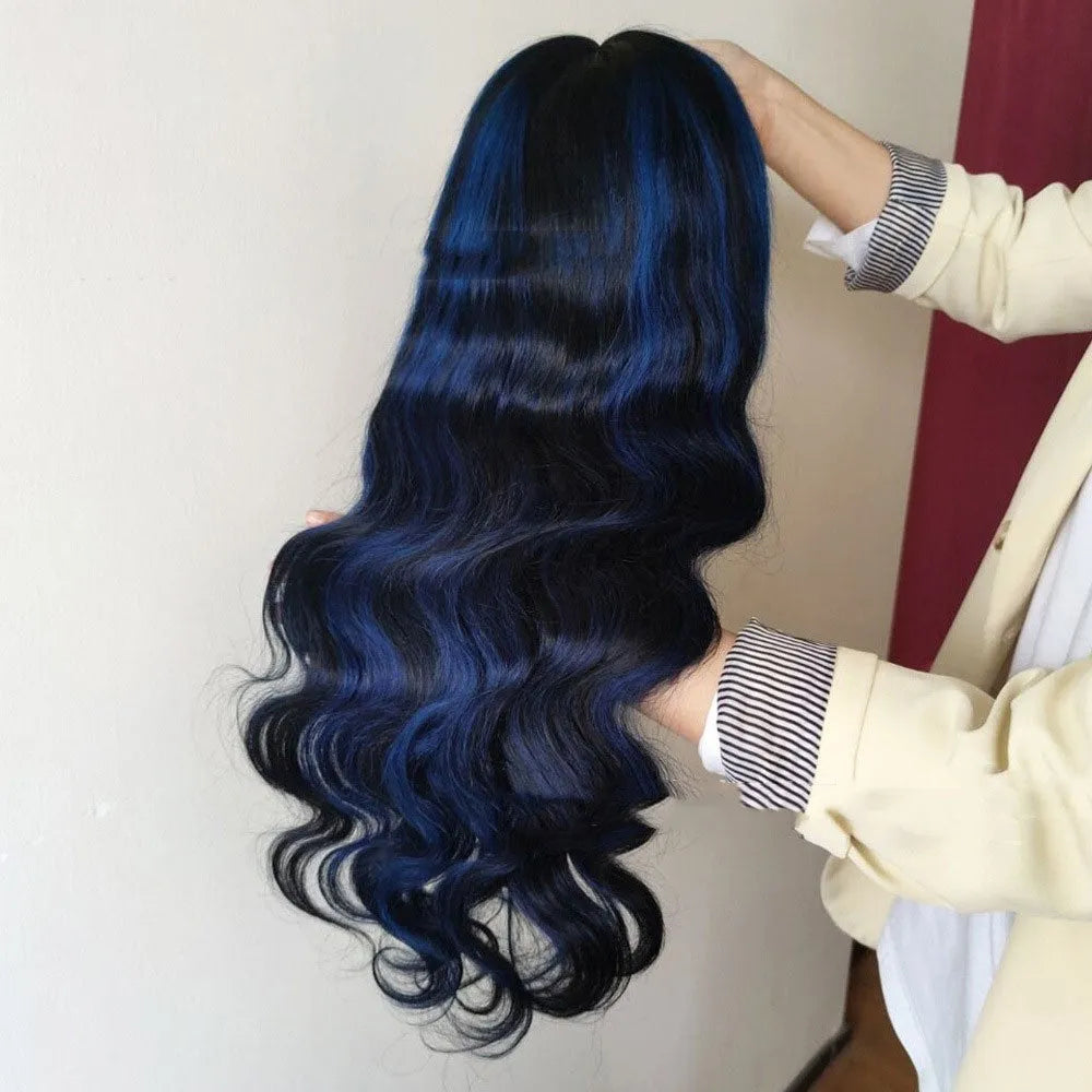 A woman wearing a long real human hair wig with a visible 4x4 lace front hairline.