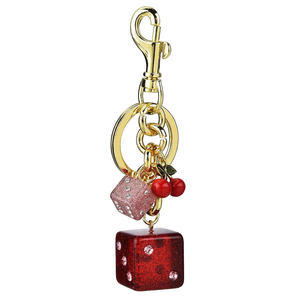 Vintage cherry two-tone dice design on a square electroplated metal keychain pendant.