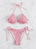 Women's apricot coloured underwire bikini swimsuit with adjustable side-tie bottoms on a mannequin.