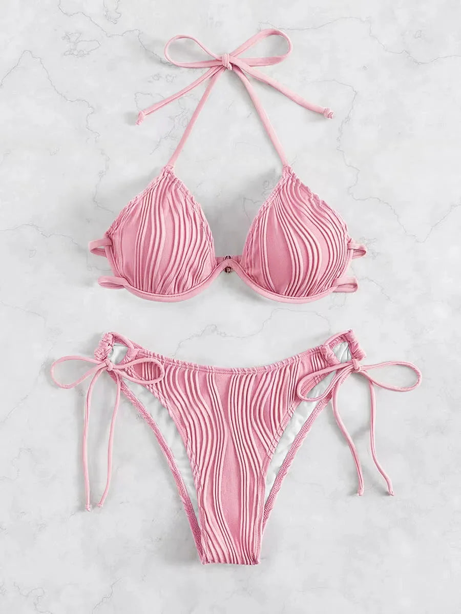 Women's apricot coloured underwire bikini swimsuit with adjustable side-tie bottoms on a mannequin.