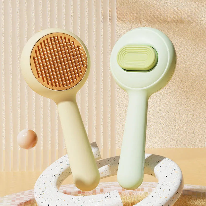 Green pet grooming brush with stainless steel pins and non-slip handle for cat and dog hair removal.