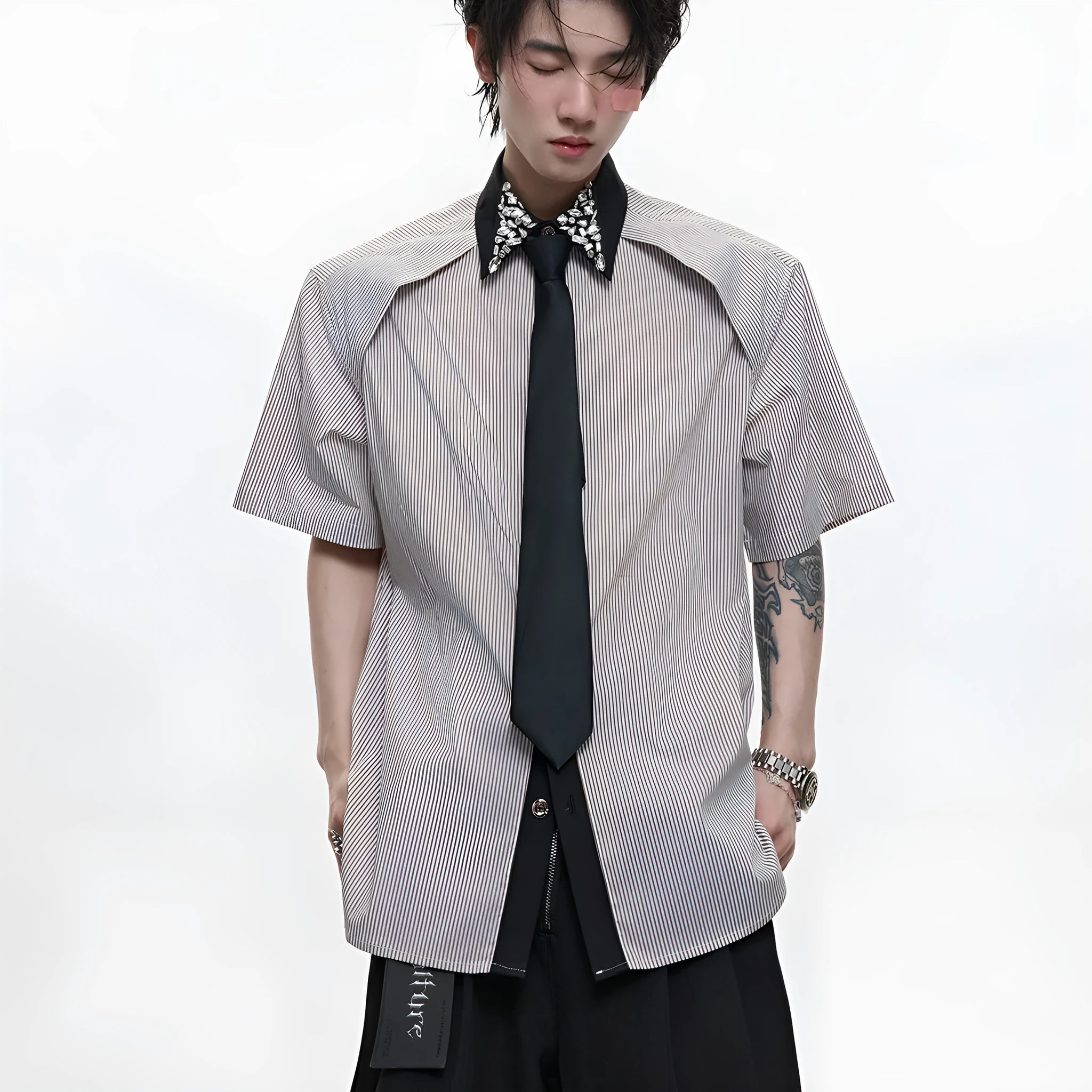 Men's blue loose fit diamond tie patchwork striped shirt with flip collar and button decorations.