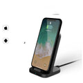 Dark grey vertical wireless charging stand for Apple iPhone smartphones on desktop