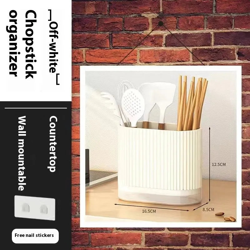 Plastic wall-mounted chopstick and spoon holder tube with drainage holes in beige colour.