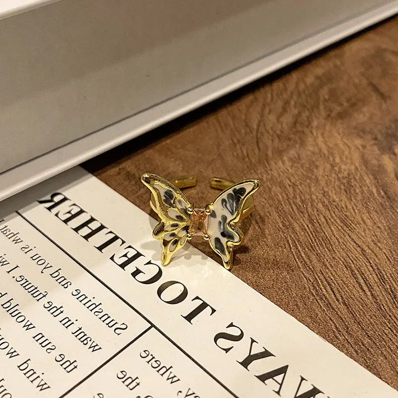 Copper women's ring featuring a creative Chinese butterfly design, available in multiple colours.