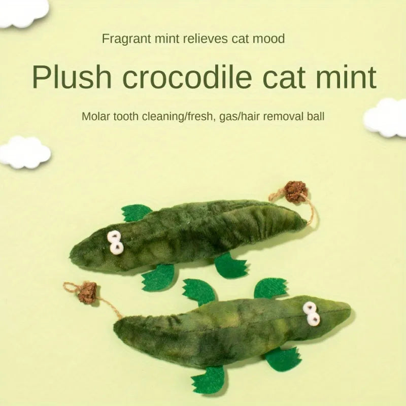Green plush alligator cat toy with plant-based materials and peppermint scent for oral cleansing