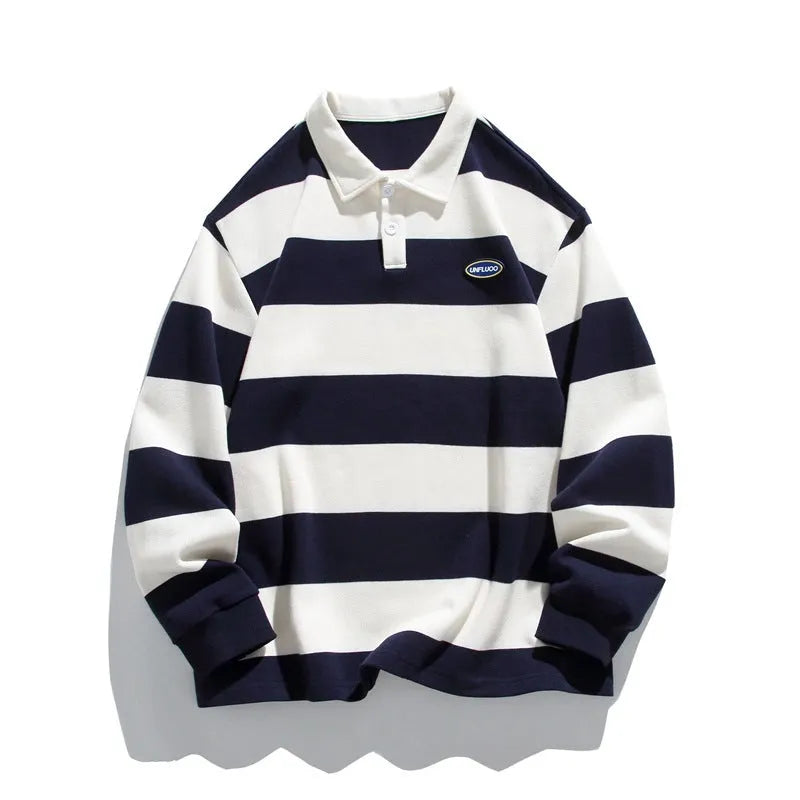 A loose-fitting, striped pearl cotton polo shirt with a lapel collar, shown in sapphire blue.