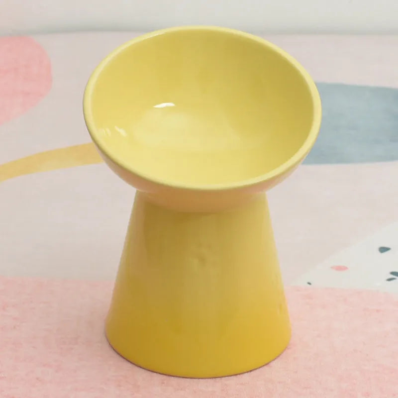 Ceramic pet bowl with anti-tumble design and raised chin support for cats and dogs