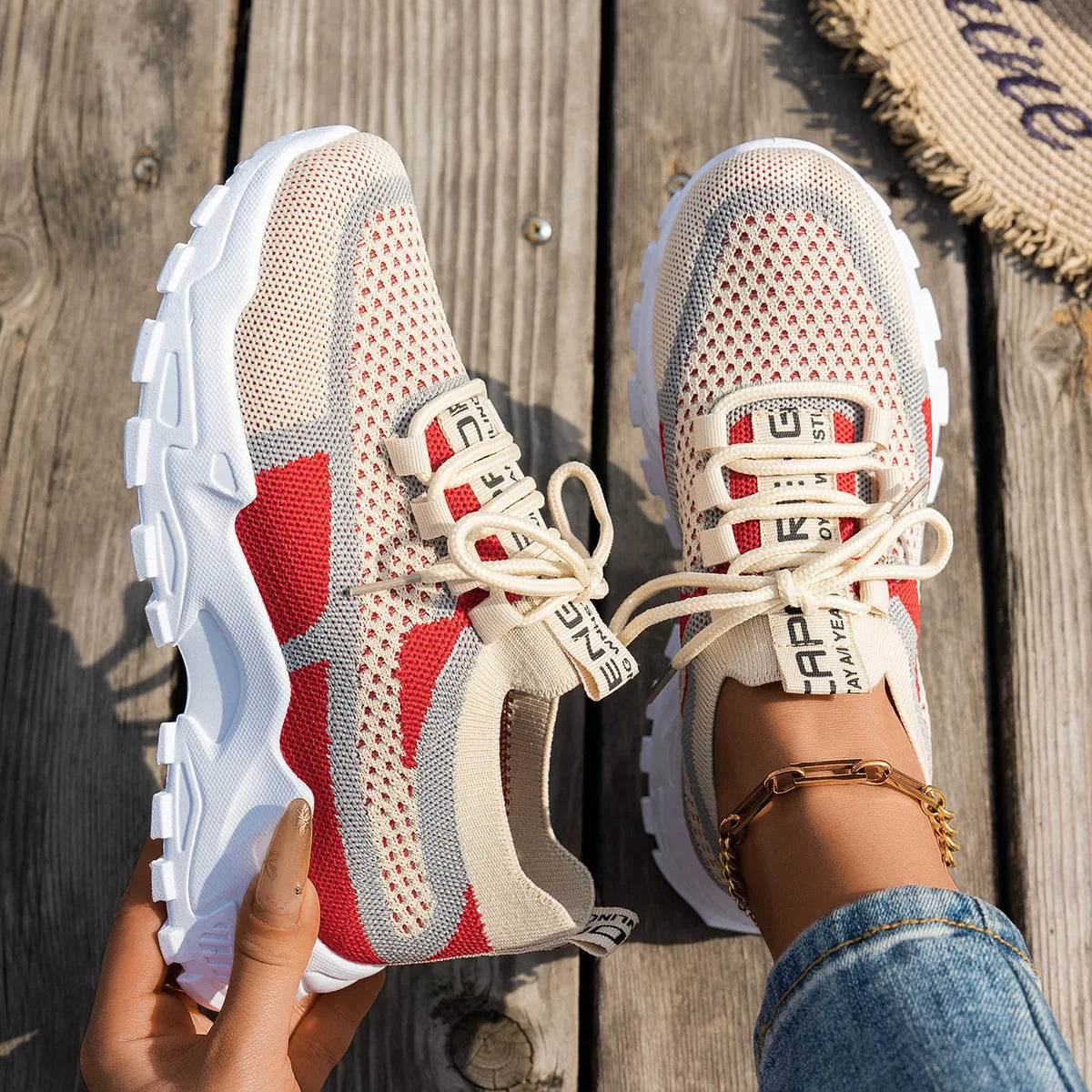 Women's Flyknit mesh lace-up sneakers in multiple colours on a rubber sole.
