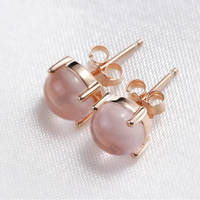 Rose gold drop shape stud earrings with synthetic ross quartz crystal inlay, Korean style.
