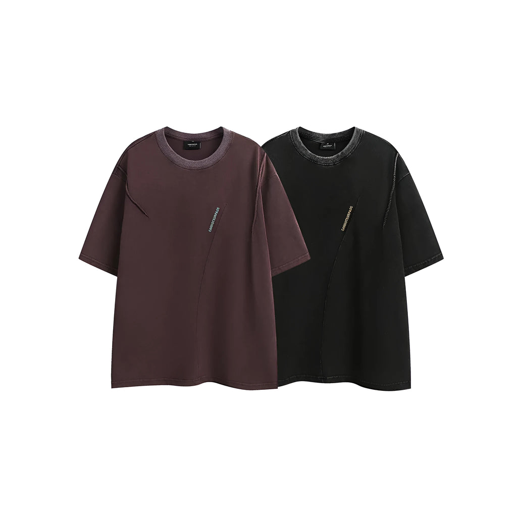 Purple and black loose-fit short-sleeved cotton t-shirt with embroidered retro design on a washed fabric.