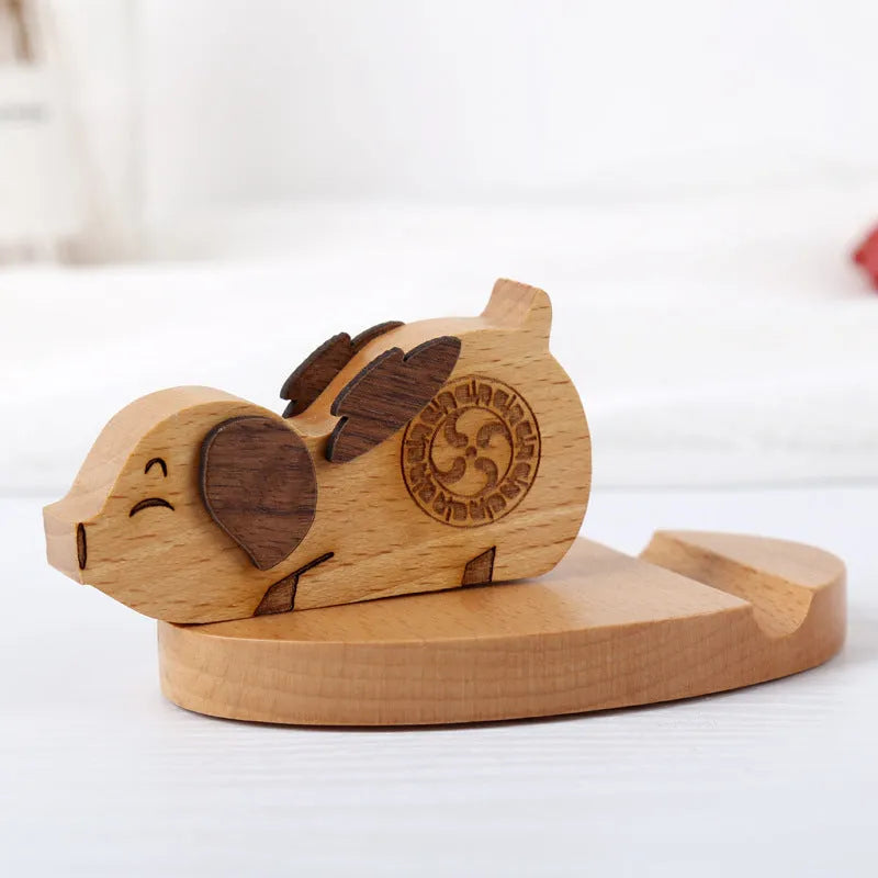 Solid beech wood mobile phone holder with detailed resin animal carving in choice of 22 animal styles