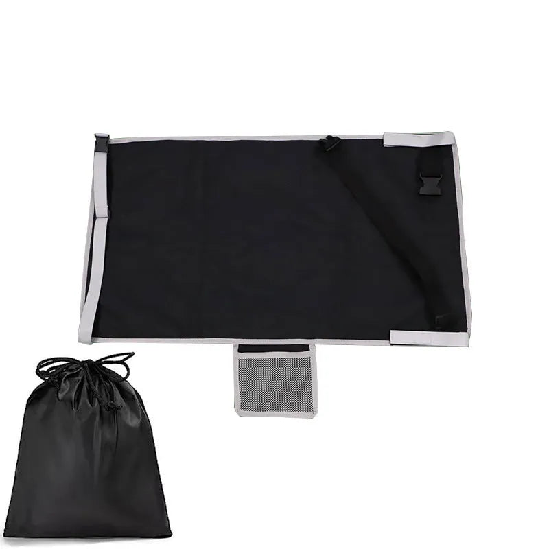 Portable grey nylon children's aircraft seat pedal extender with a matching drawstring pocket.