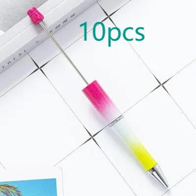 Creative ballpoint pen with multicoloured spinning plastic beads on a steel wire frame.