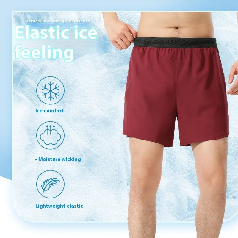 Men's solid colour low-waist basketball shorts made from polyester fabric.