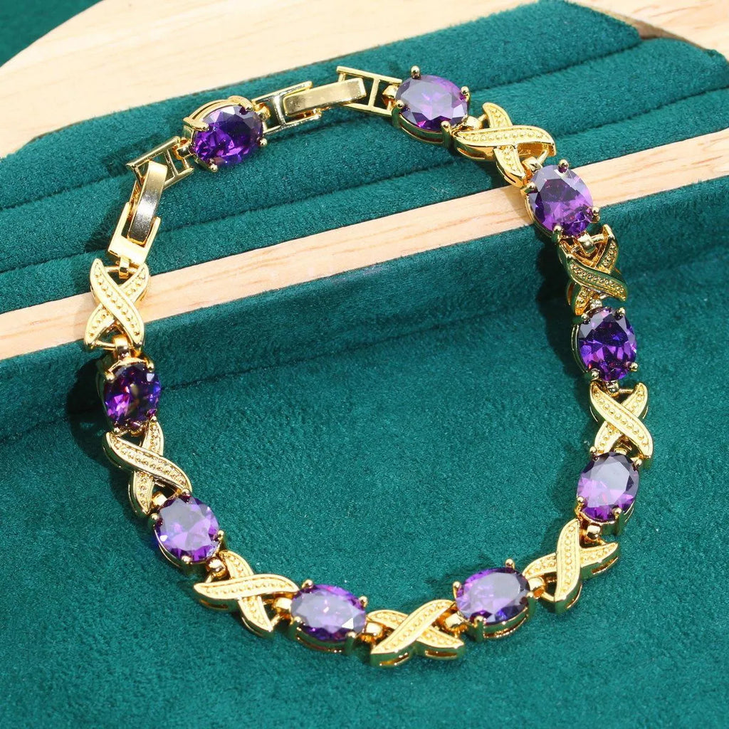 18k gold plated jewellery set with multi-colour cubic zirconia stones including necklace, earrings, ring, and bracelet.