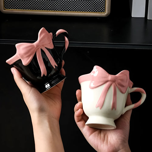 Ceramic mug with heart bow design in Black Pink colour, 301-400ml capacity.