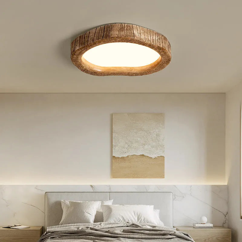 Round wood grain finish ceiling lamp in New Chinese style hanging from a ceiling.