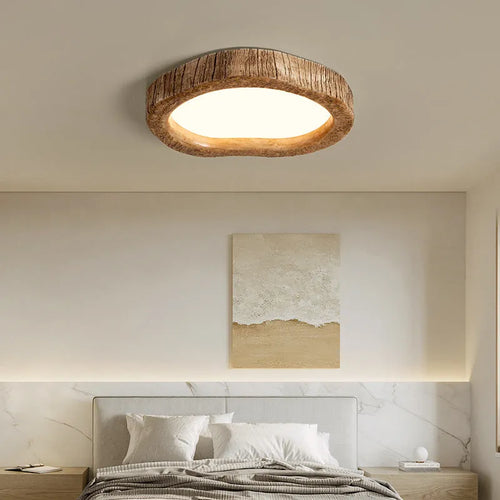 Round wood grain finish ceiling lamp in New Chinese style hanging from a ceiling.