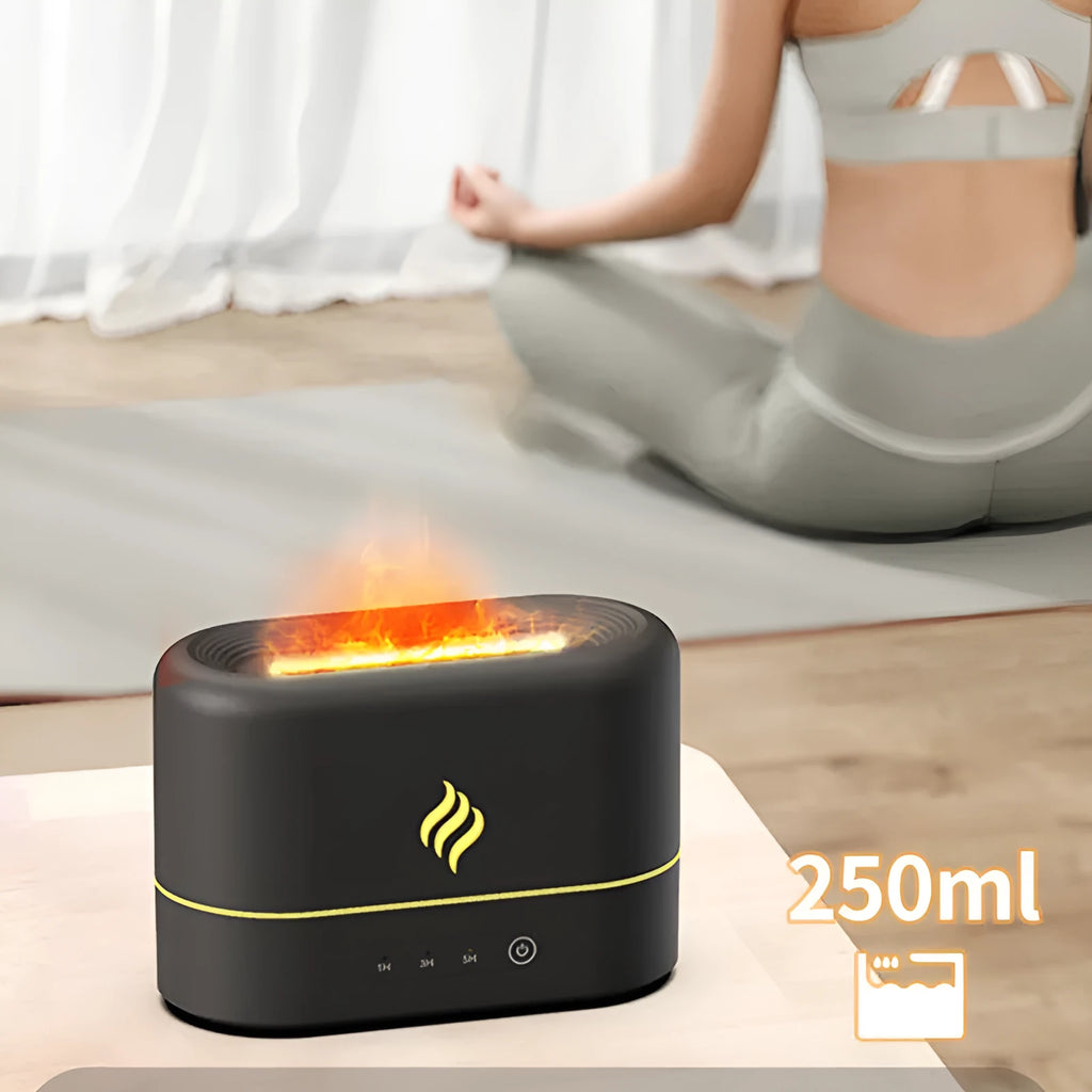 Black USB humidifier displaying a seven-colour flame effect on a desk next to a plant.