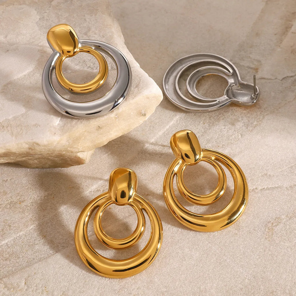 Gold plated titanium steel double layer hollow stud earrings with round geometric design