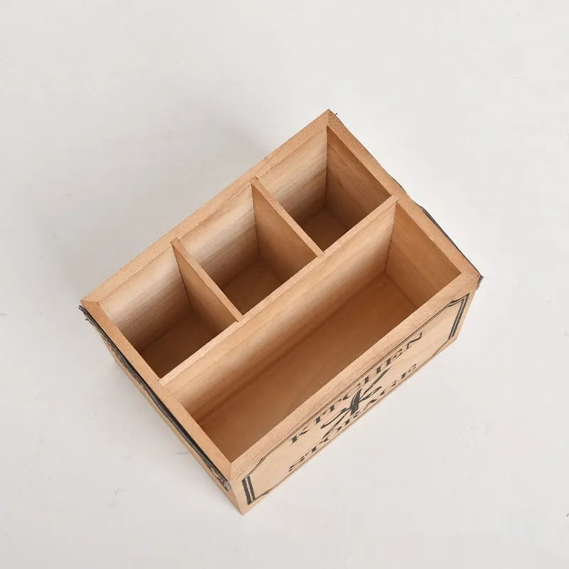 Natural wooden kitchen storage box with internal grid dividers for organising knives, forks, and chopsticks.