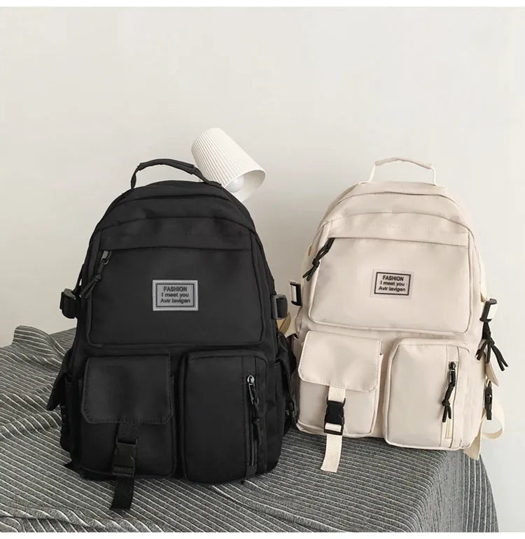 Black and white nylon student backpack with laptop compartment and three-dimensional pockets