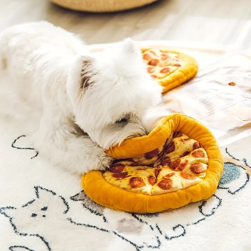 Yellow pizza slice shaped rubber dog chew toy with textured ridges and a squeaker.