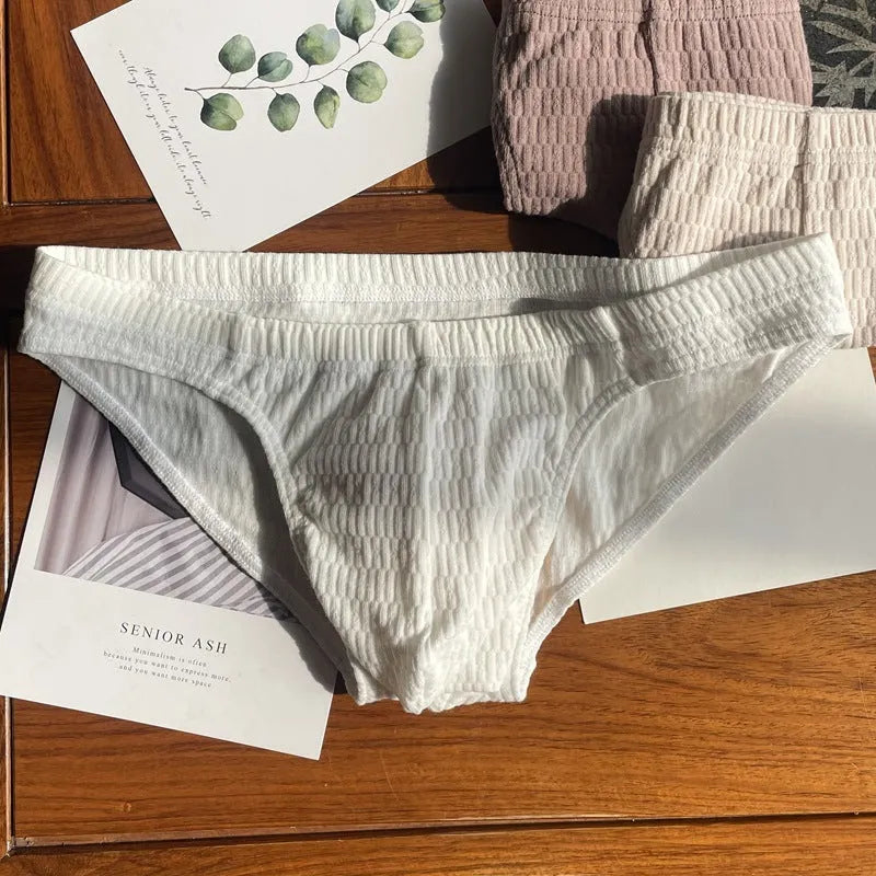 Men's solid colour cotton triangle underwear briefs with mid waistband, shown in apricot black colour.