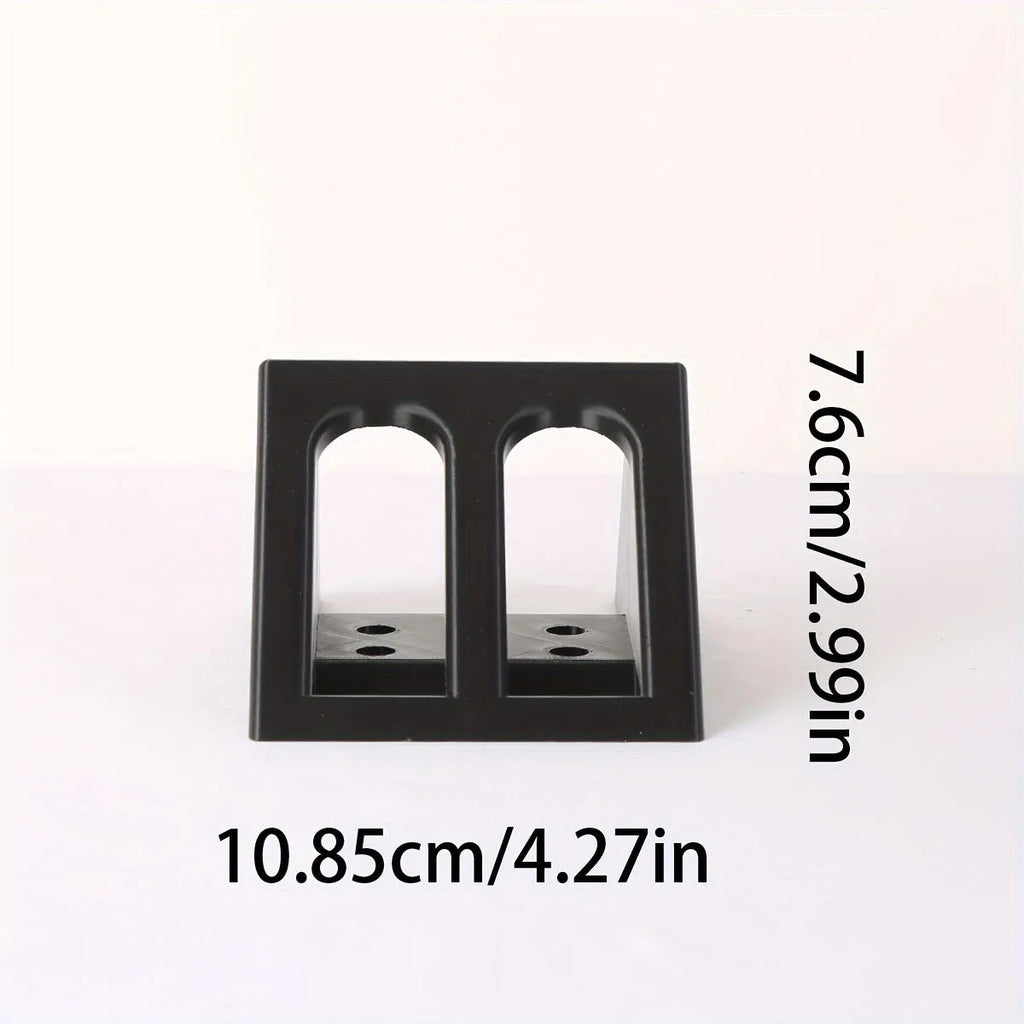 Black punk-style plastic pistol stand for airsoft and display models, measuring 10.85 by 7.6 cm.