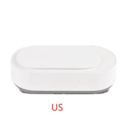 White portable ultrasonic cleaning machine with a stainless steel tank for jewellery and glasses.