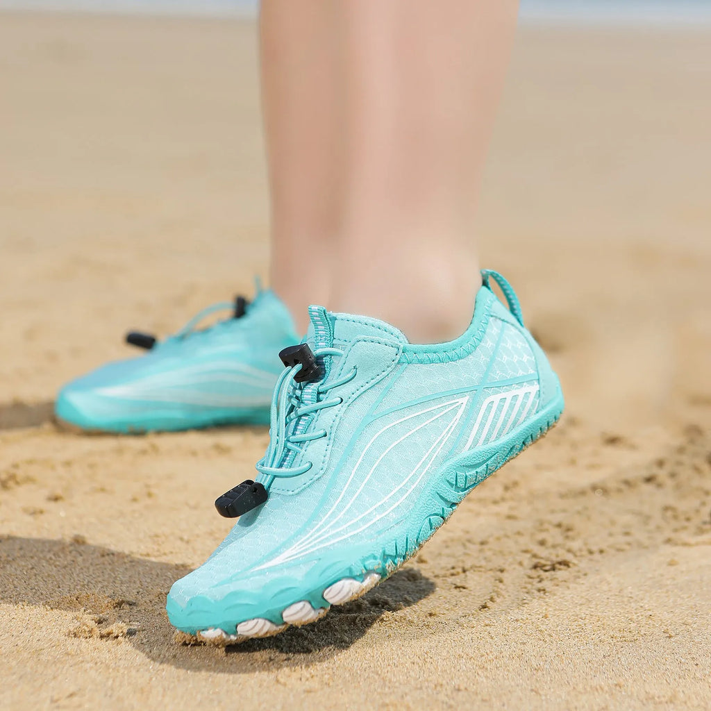 Children's elasticated water shoes in blue with a non-slip rubber sole and breathable mesh upper.