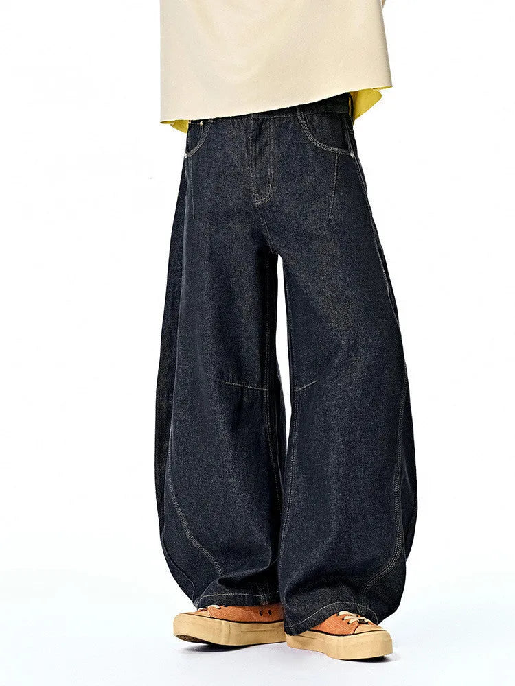 Men's original cow colour wide leg denim trousers with a mid-waist, laid flat.