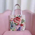 Double-sided gold wire embroidered canvas bag showing Monet flowers design with polyester lining