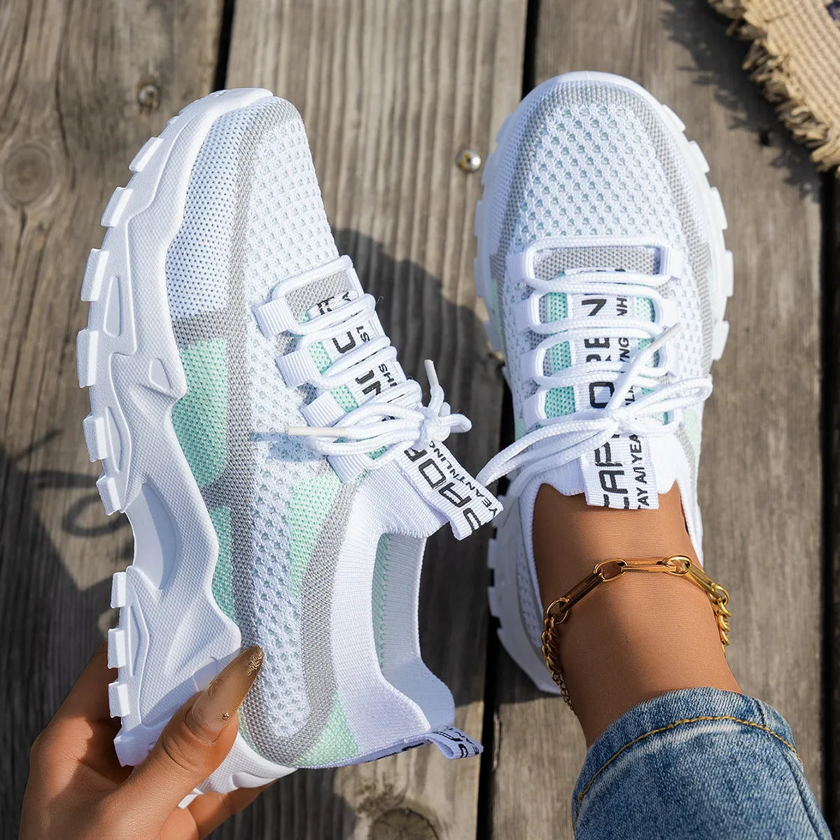 Women's Flyknit mesh lace-up sneakers in multiple colours on a rubber sole.