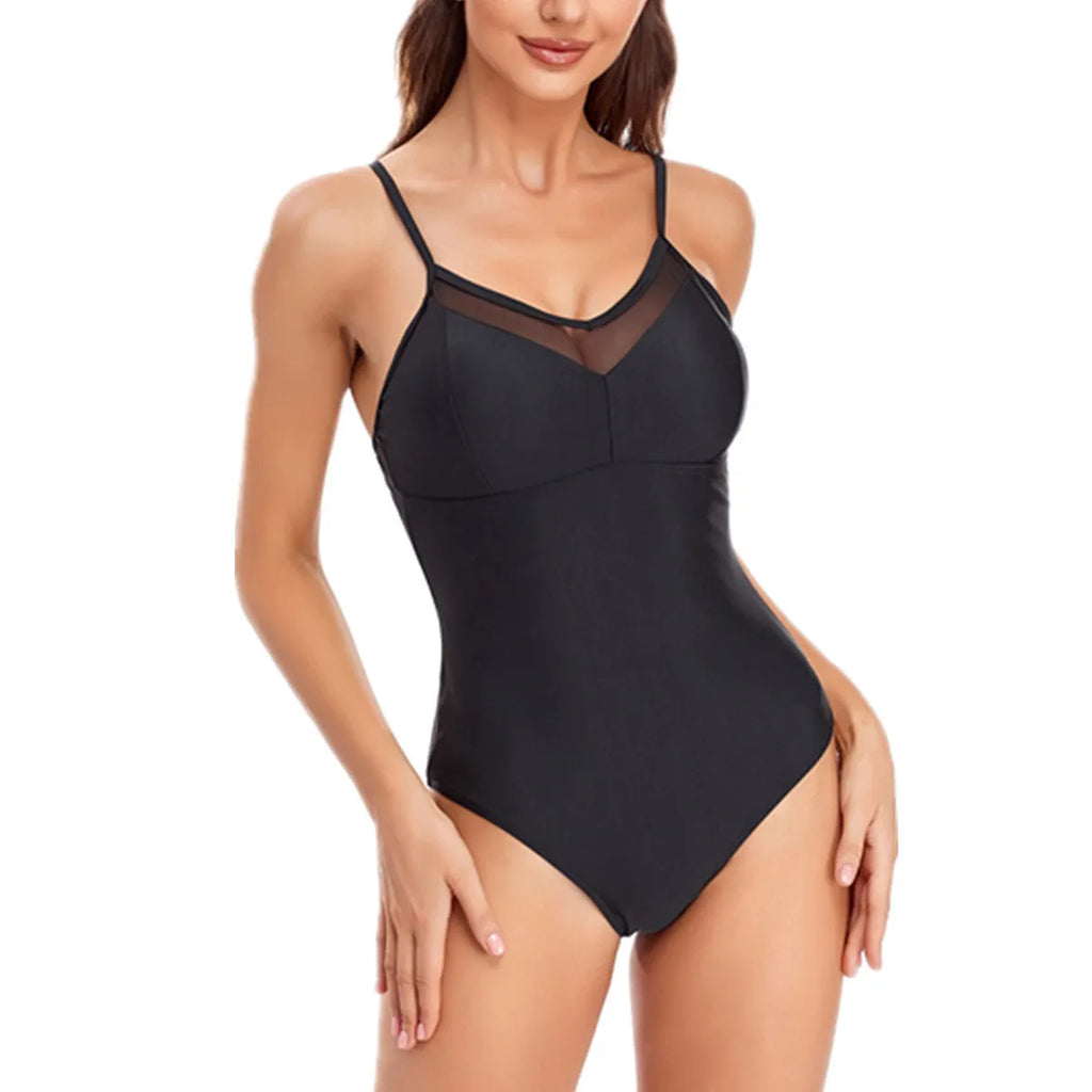 Ladies solid colour one-piece swimsuit with backless mesh design in black or blue.