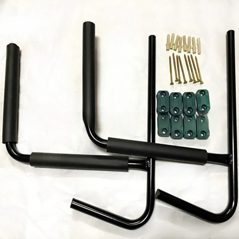 Carbon steel kayak and surfboard wall storage rack mounted on a garage wall.