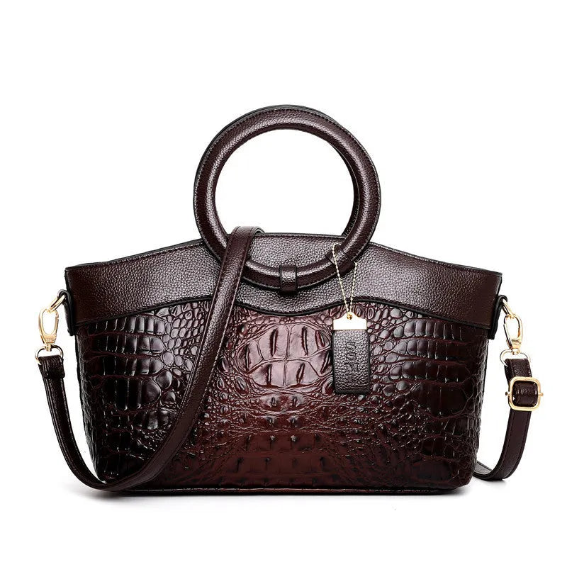 Fabric ladies handbag showing multiple compartments including phone and ID sections